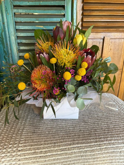 Wild Thing - Banksia, protea, native flowers are arranged .