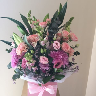 Blush Elegance - A sophisticated floral gift bag showcasing soft blush tones, rich textures, and graceful seasonal foliage. Expertly arranged to create height, depth, and natural movement, this elegant design is finished with a delicate ribbon and stylish presentation. Perfect for birthdays, anniversaries, new baby celebrations, thank-you gifts, or any occasion that calls for a touch of refined beauty and charm.